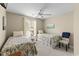 Bright bedroom offers two twin beds, a ceiling fan, and a peaceful atmosphere for relaxation at 4396 Baldwin Ave. # 30, Little River, SC 29566