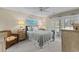 Cozy bedroom features a comfortable bed, soft lighting, and sliding glass doors for natural light at 4396 Baldwin Ave. # 30, Little River, SC 29566