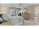Comfortable bedroom with neutral tones, soft bedding, and a view of the outdoors through shuttered windows at 4396 Baldwin Ave. # 30, Little River, SC 29566