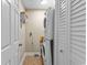 Efficient laundry room featuring a stacked washer and dryer unit, maximizing space in the home at 4396 Baldwin Ave. # 30, Little River, SC 29566