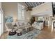 Bright and airy living space with high ceilings, comfortable seating, and an open view to the dining area at 4396 Baldwin Ave. # 30, Little River, SC 29566