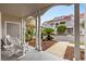 Inviting covered front porch with white rocking chairs and views of the landscaped yard at 4396 Baldwin Ave. # 30, Little River, SC 29566