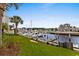 Beautiful waterfront view showcases the serene marina with its yachts and picturesque surroundings from the grassy lawn at 4396 Baldwin Ave. # 30, Little River, SC 29566