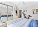 Bright bedroom featuring a queen size bed, mirrored closet doors, and a stationary exercise bike at 4486 Little River Inn Ln. # 2103, Little River, SC 29566
