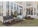 Exterior of a home featuring a sunroom with multiple windows and manicured landscaping at 4486 Little River Inn Ln. # 2103, Little River, SC 29566