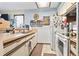 Functional kitchen equipped with ample counter space, standard appliances, and convenient spice rack at 4486 Little River Inn Ln. # 2103, Little River, SC 29566