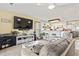 Inviting living room featuring a flat-screen TV and a seamless transition to the kitchen bar area at 4486 Little River Inn Ln. # 2103, Little River, SC 29566