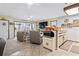 Open living space flows into the kitchen area with a large screen TV and easy access to appliances at 4486 Little River Inn Ln. # 2103, Little River, SC 29566