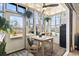 Bright sunroom filled with natural light, perfect for dining or relaxing with views of the outdoors at 4486 Little River Inn Ln. # 2103, Little River, SC 29566