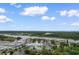 Breathtaking aerial view of 4505 Lightkeepers Way, with water views, nearby marina, lighthouse and lush green landscaping at 4505 Lightkeepers Way # 24B, Little River, SC 29566
