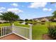 Relaxing porch offering serene views of the pond and lush landscaping at 4505 Lightkeepers Way # 24B, Little River, SC 29566