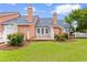 Well-maintained backyard featuring deck, mature trees, and a lush lawn at 4505 Lightkeepers Way # 24B, Little River, SC 29566