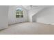 Bright bedroom featuring a large arched window and neutral carpeting at 4505 Lightkeepers Way # 24B, Little River, SC 29566