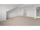 Large bedroom featuring neutral carpet and adjoining hallway at 4505 Lightkeepers Way # 24B, Little River, SC 29566