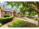 Beautifully landscaped townhomes with vibrant greenery and well-maintained walkways leading to entrances at 4505 Lightkeepers Way # 24B, Little River, SC 29566