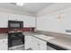 Kitchen featuring white cabinets and stainless steel appliances at 4505 Lightkeepers Way # 24B, Little River, SC 29566