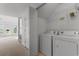 Functional laundry room featuring modern washer and dryer units at 4505 Lightkeepers Way # 24B, Little River, SC 29566