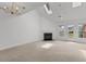 Bright living room featuring vaulted ceilings, skylights, a fireplace and access to the backyard at 4505 Lightkeepers Way # 24B, Little River, SC 29566