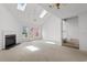 Bright living room featuring vaulted ceilings, skylights, fireplace and access to the backyard at 4505 Lightkeepers Way # 24B, Little River, SC 29566