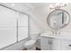 Bathroom featuring a shower and tub combo with sliding glass doors and a marble sink vanity at 4505 S Ocean Blvd. # 5D, North Myrtle Beach, SC 29582
