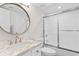 Bright bathroom featuring a marble sink vanity and shower and tub combo with sliding glass doors at 4505 S Ocean Blvd. # 5D, North Myrtle Beach, SC 29582