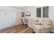 Cozy bedroom featuring a wall bed with built in shelving, desk area, and comfortable armchair at 4505 S Ocean Blvd. # 5D, North Myrtle Beach, SC 29582