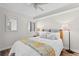Comfortable bedroom with a full sized bed, shutters, and a lamp on each side of the bed at 4505 S Ocean Blvd. # 5D, North Myrtle Beach, SC 29582