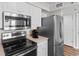 Updated kitchen features stainless steel appliances and white cabinets at 4505 S Ocean Blvd. # 5D, North Myrtle Beach, SC 29582