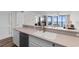 Kitchen with stainless steel dishwasher and sink and a view to the living room and outdoor patio with a beautiful ocean view at 4505 S Ocean Blvd. # 5D, North Myrtle Beach, SC 29582