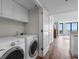 Laundry room featuring a washer and dryer located near the entrance to the balcony at 4505 S Ocean Blvd. # 5D, North Myrtle Beach, SC 29582