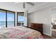 Bright main bedroom featuring balcony access and ocean views at 4505 S Ocean Blvd. # 5D, North Myrtle Beach, SC 29582