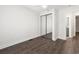 Bedroom featuring hardwood floors, a closet, and an attached bathroom at 4510 Little River Inn Dr. # 2708, Little River, SC 29566