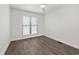 Bedroom featuring a window, ceiling fan, hardwood floors, and white walls at 4510 Little River Inn Dr. # 2708, Little River, SC 29566