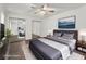 Virtually staged bedroom with hardwood floors, ceiling fan, and modern decor at 4510 Little River Inn Dr. # 2708, Little River, SC 29566