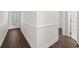 Bright hallway featuring elegant trim work and durable wood-look floors at 4510 Little River Inn Dr. # 2708, Little River, SC 29566