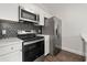 Modern kitchen with stainless steel appliances and a stylish backsplash creates an elegant cooking space at 4510 Little River Inn Dr. # 2708, Little River, SC 29566
