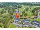 Aerial view of well-maintained condo buildings overlooking a scenic golf course and pristine lakes at 4811 Orchid Way # 301, Myrtle Beach, SC 29577