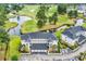 Overhead view of property showcasing landscaping, garage, golf course, and lake views at 4811 Orchid Way # 301, Myrtle Beach, SC 29577
