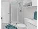Bright bathroom features a glass enclosed shower, toilet, and vanity sink at 4811 Orchid Way # 301, Myrtle Beach, SC 29577