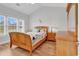This cozy bedroom has lots of natural light and wood floors at 4811 Orchid Way # 301, Myrtle Beach, SC 29577