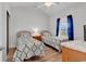 Bright bedroom features vaulted ceilings, two twin beds, wood floors, and a closet at 4811 Orchid Way # 301, Myrtle Beach, SC 29577