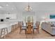 Inviting dining area with adjacent kitchen and living space, complete with a breakfast bar and natural lighting at 4811 Orchid Way # 301, Myrtle Beach, SC 29577
