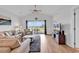 Spacious living room with natural light, comfortable seating, and sliding glass doors with golf course views at 4811 Orchid Way # 301, Myrtle Beach, SC 29577