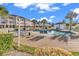 Relaxing community pool area with lounge chairs and well-maintained landscaping at 4811 Orchid Way # 301, Myrtle Beach, SC 29577
