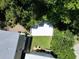 Aerial view of the property's deck and outdoor kitchen, with surrounding lawn and mature trees at 52 Fish Shack Alley, Murrells Inlet, SC 29576
