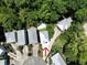 Aerial view of property showcasing the home, its landscaping, and surrounding trees at 52 Fish Shack Alley, Murrells Inlet, SC 29576