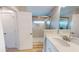 Bathroom featuring a white vanity with brushed nickel fixtures, framed glass shower, and wood-style flooring at 52 Fish Shack Alley, Murrells Inlet, SC 29576