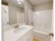 This bathroom features a single sink vanity with white countertop and a tub and shower combo at 52 Fish Shack Alley, Murrells Inlet, SC 29576