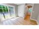 Bedroom with sliding glass doors to the outside and hardwood flooring at 52 Fish Shack Alley, Murrells Inlet, SC 29576