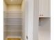 This walk-in pantry includes bright wood floors and three levels of wired shelving at 52 Fish Shack Alley, Murrells Inlet, SC 29576